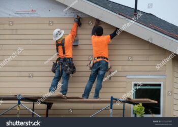 Construction Workers Installing Vinyl Siding Facade Stock Photo ...